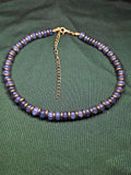 Crackle blue and purple glass and gold bead necklace